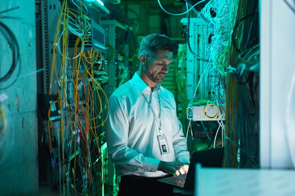 Mature Network Engineer Setting Up Network